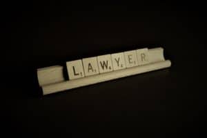 scrabble letters spell the word lawyer
