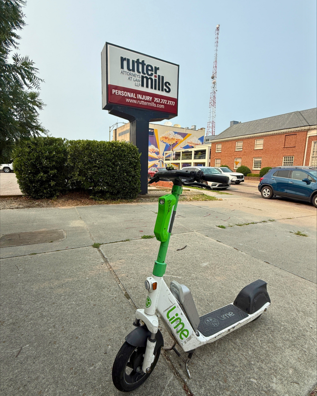 Lime scooter parked in front of Rutter Mills Law Firm in Norfolk, Virginia